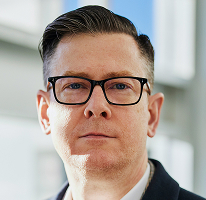 Fotografia di Alexander Hughes executive e CEO di società di crypto trading
